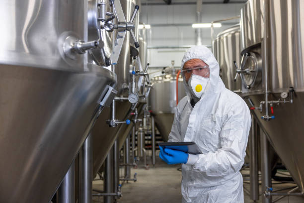 istock Experienced engineer overseeing the beer production equipment in a factory 1453463882