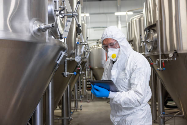 istock Experienced beer tech carrying out the quality control of equipment 1453463883