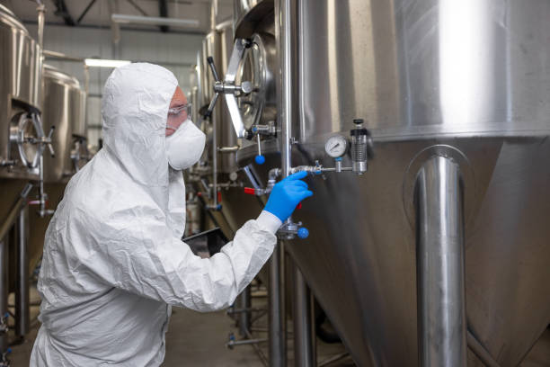 istock Engineer inspecting the brewing equipment in a factory 1453463887