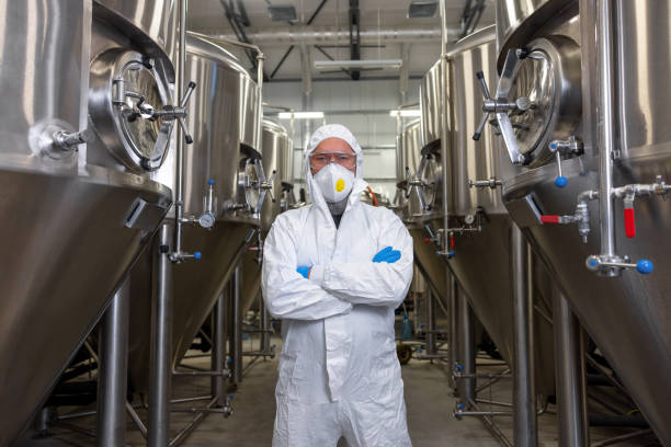 istock Serious brewer standing next to the brewing equipment 1453463904