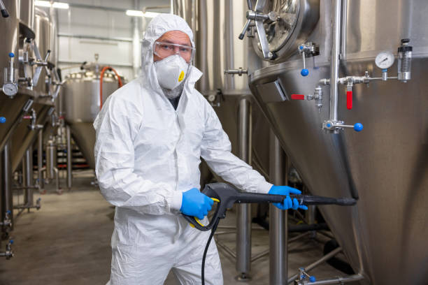 istock Factory worker disinfecting the beer production equipment 1453463908