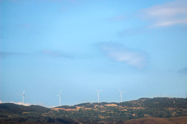 istock Windmills on the hill. Copy space with blue sky. 1453465865