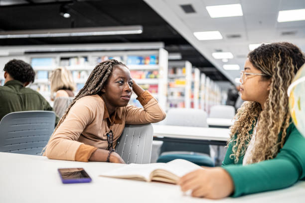 istock Female friends talking at university 1453466549