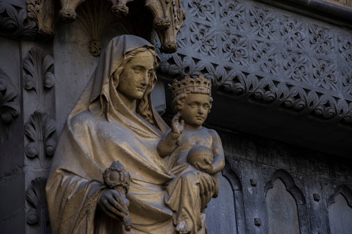 A close-up shot of the statue of the Virgin Maria with Christ in Westminster Abbey, London, England