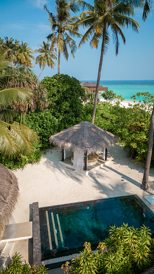 Maldives Hotel Beach Villa with Pool on tropical Island Resort aerial drone