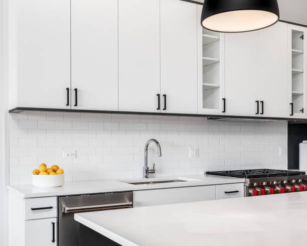 istock A kitchen detail with white cabinets and a chrome faucet. 1453472733