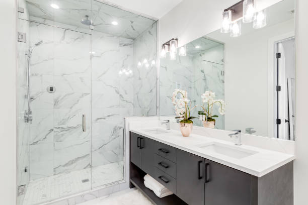istock A bathroom with a grey cabinet and marble shower. 1453472823