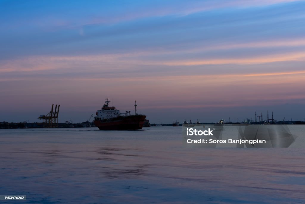 Pier and boats on the river on twilight time at Thailand. Pier and boats on the river on twilight time, beautiful sky at Thailand. Asia Stock Photo
