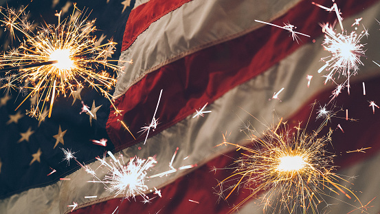 Vintage Celebration With Sparklers And Defocused American Flag