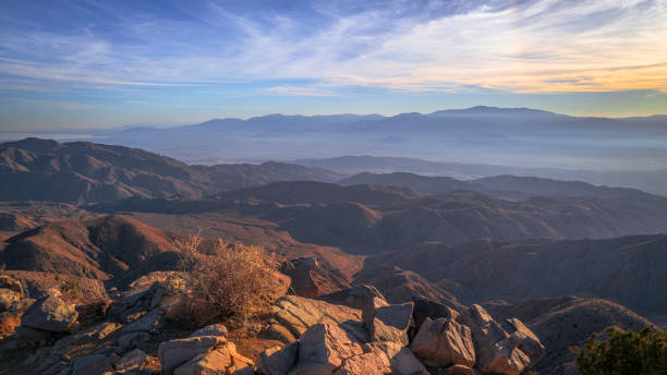 istock Joshua Tree National Park, Keys View summit at sunset, a high viewpoint with mesas, Coachella Valley, Palm Springs, and Mt San Jacinto 1453479914