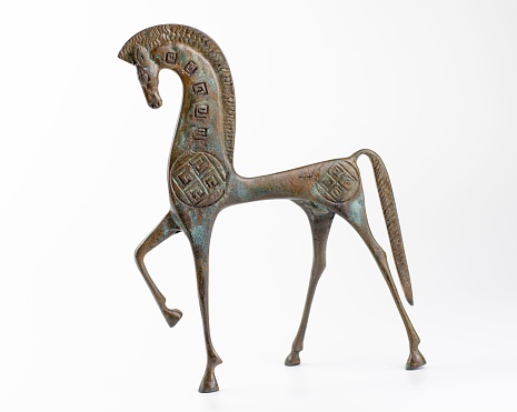Bronze etruscan horse sculpture on white background. Horse miniature.