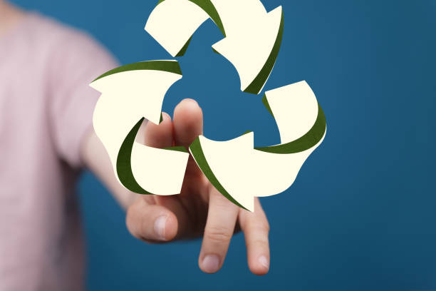 istock 3D rendering of a man pointing at a floating recycling icon against a blurred background 1453482633