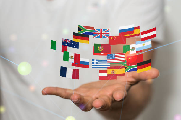 istock Hand with colorful flag illustrations above on a blurred background 1453483208