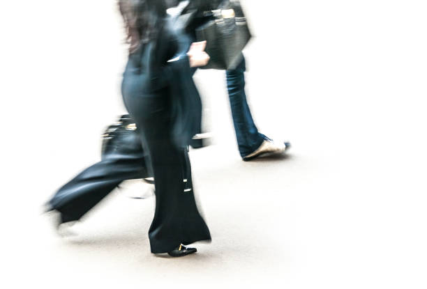 istock business women in blurry walking 1453485527
