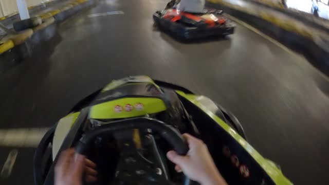 People driving go-karts
