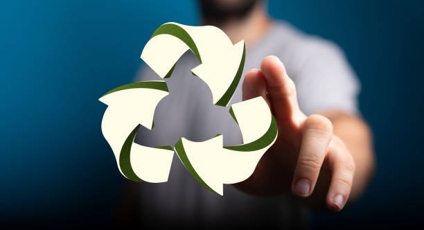 istock Hand pointing to a digital recycling sign on a blurred background 1453487676