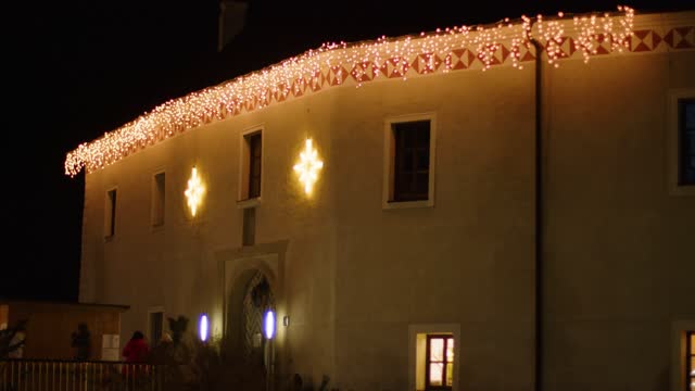 christmas lights on historic castle Traun facade