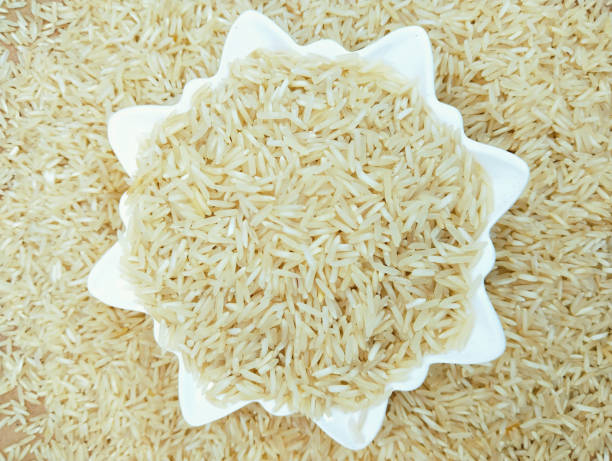 Polished white rice cereal grains raw wholerice hulled milled-rice staple food kacha chawal riz poli arroz polido arroz pulido polierter reis oryza sativa in a bowl closeup image photo stock photo