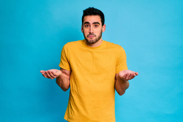 istock Shocked man showing palms up and looking at camera 1453494596