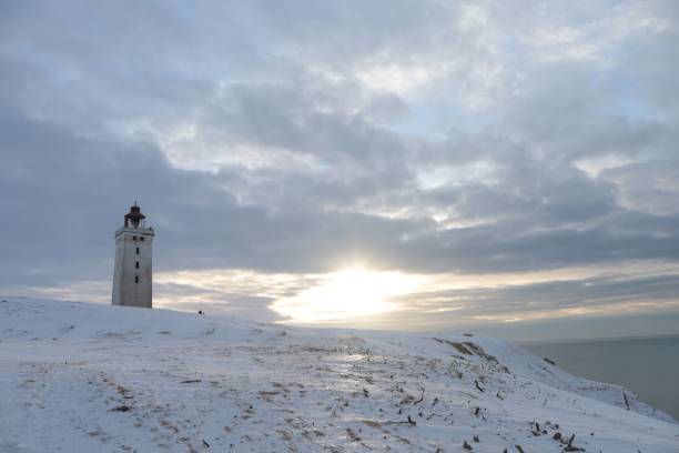 istock Low-angle shot of a beautiful lighthouse during the sunset 1453497226
