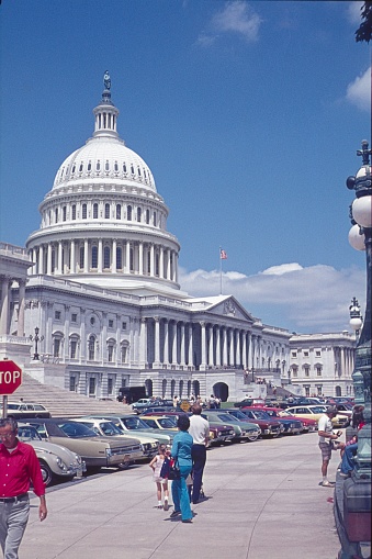 Washington DC, USA, 1977. In front of the Capitol in Washington DC. Furthermore: pedestrians and parked cars.