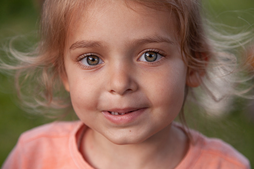 Close-up of a smiling child looking at camera