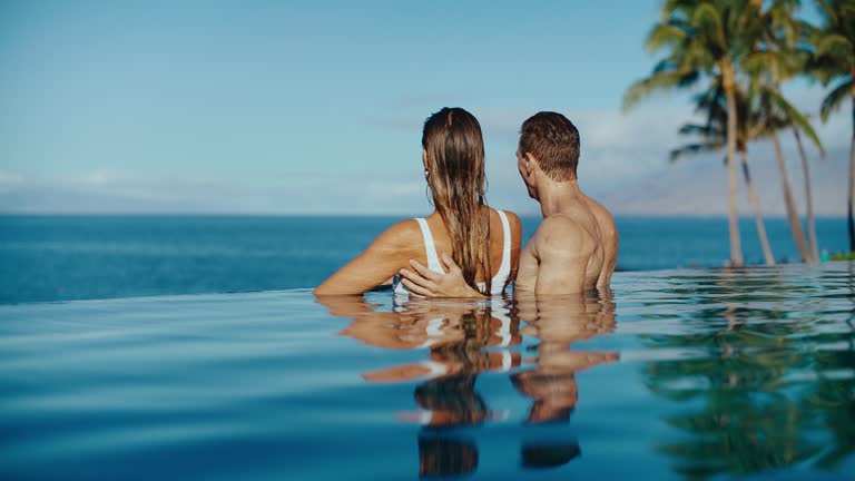 Couple Relaxing in the Pool at Luxury Resort