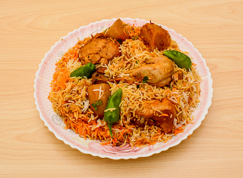 chicken biryani or biriyani served in plate isolated on table top view indian spicy food