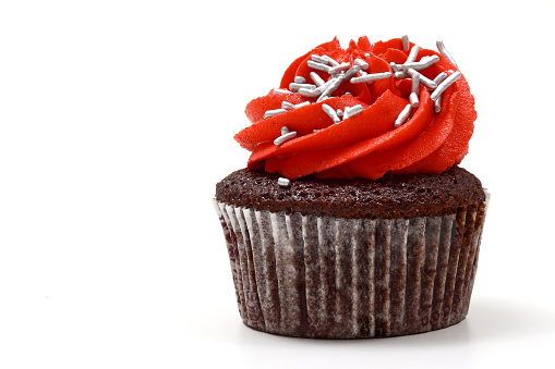 creamy cupcake in shades of red on white background