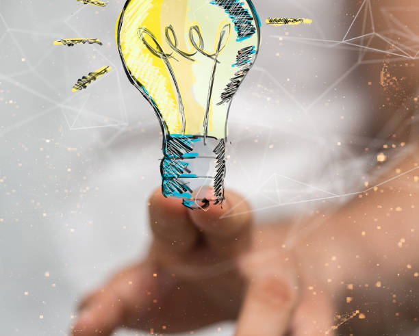 istock Closeup of a hand touching a 3D rendered lamp idea, creativity and innovation concept 1453507090