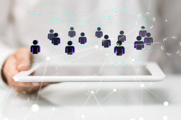istock 3d render of hologram people on a tablet held by a male conference Digital Network and data concept 1453508470