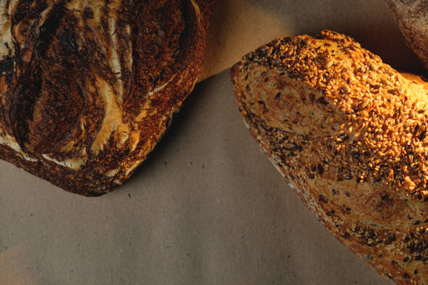 istock Various types of fresh craft bread. Top view. 1453508586