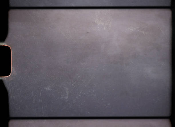 empty or blank 8mm film frame with black border and dust.