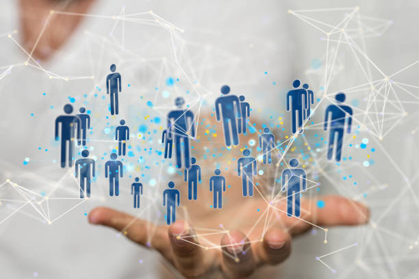 istock 3D rendering of human icons over a hand-social network communication concept 1453520323