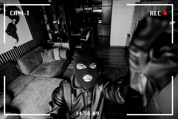 Housebreaking Concept. Intruder sneaking into house at night, holding crowbar, top view from above camera, high angle. criminal breaks the camera in the house. robber noticed a security camera. Housebreaking Concept. Intruder sneaking into house at night, holding crowbar, top view from above camera, high angle. The robber noticed a security camera. criminal breaks the camera in the house. interception stock pictures, royalty-free photos & images