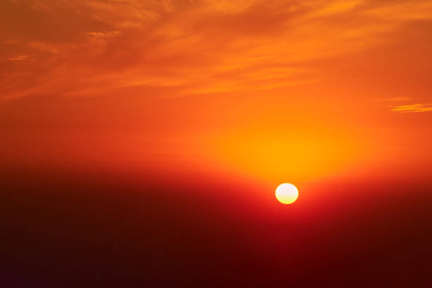 istock A red sun in the sunset sky, a summer landscape. Evening sky in hot sunlight 1453523008