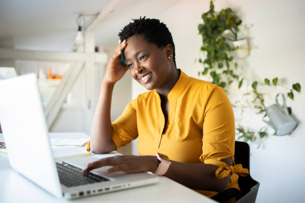 istock Young woman working from home 1453523639