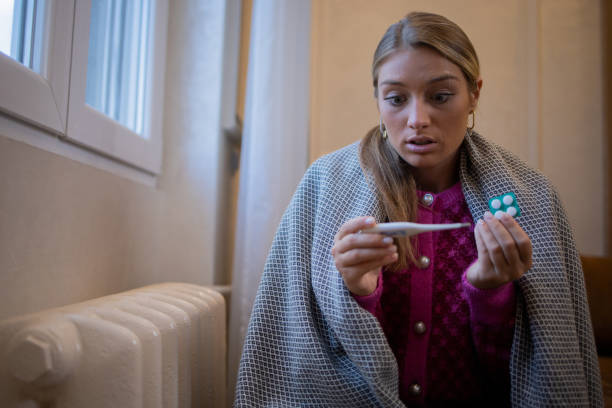 istock Woman feel cold in home with no heating 1453523721