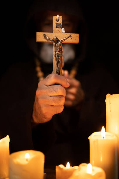 istock A priest with a cross in his hand 1453523922
