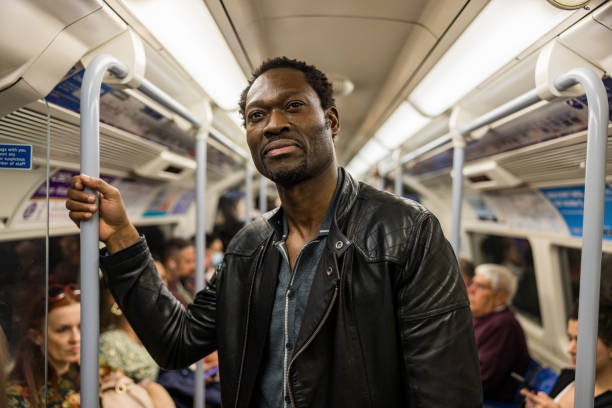 istock Mature Black Man In A Subway Train On His Way To Work 1453525010