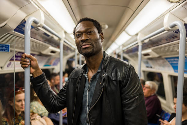 Mature Black Man In A Subway Train On His Way To Work stock photo