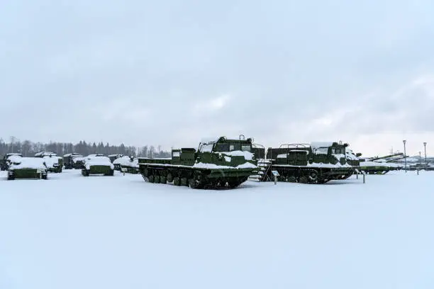 various military equipment in the snow in winter