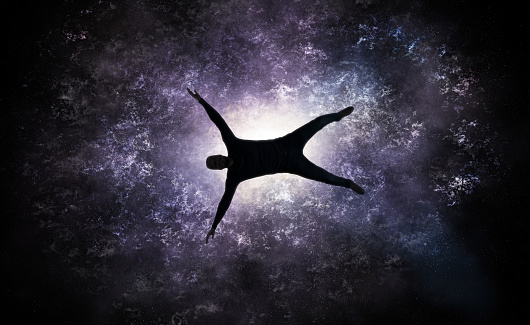 Illustration of a man falling into the center of a giant galaxy