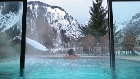 Lady inside hot water pool in Alp