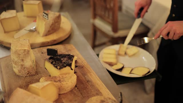 Cutting and serving French cheese