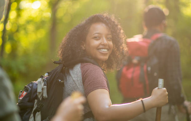 istock Young Adults Hiking in the Forest 1453533342
