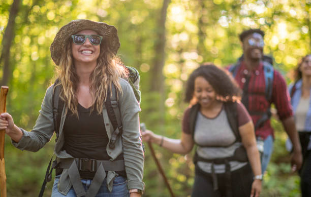 istock Young Adults Hiking in the Forest 1453533344