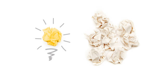 find better creative idea and innovation from paper concept, light bulb paper ball on light background