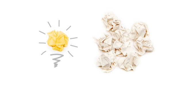 find better creative idea and innovation from paper concept, light bulb paper ball on light background stock photo