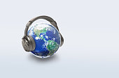 The world is listening, World music day, Earth with headphone on light background